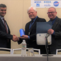 Chris Wargo (center), with Dr. Nikos Fistas and Tom Redling